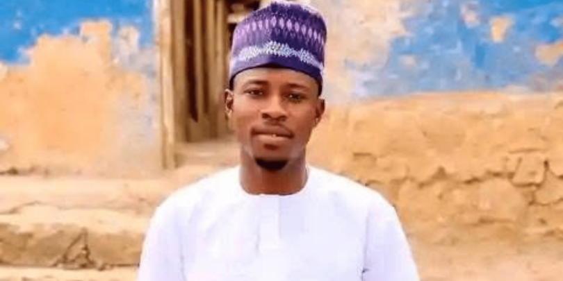 National Youth Service Corps NYSC member Haruna Ibrahim scaled