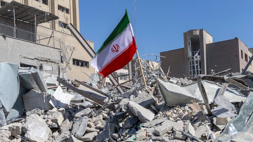 iranian flag rubble 2026