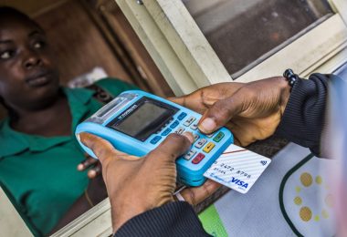 A customer validating data on a PoS machine 3
