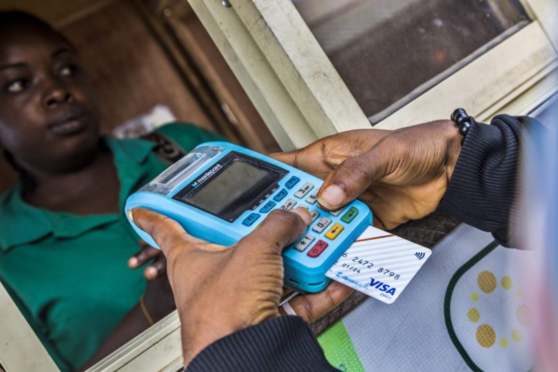 A customer validating data on a PoS machine 3