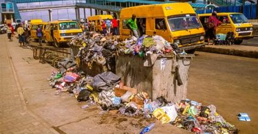Overfilled waste bin littering the road Source Authors