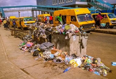 Overfilled waste bin littering the road Source Authors