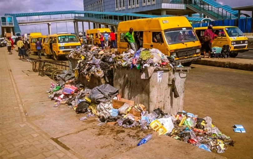 Overfilled waste bin littering the road Source Authors