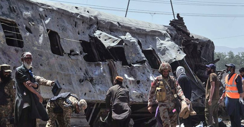 more than a dozen killed in suicide blast targeting train in pakistan