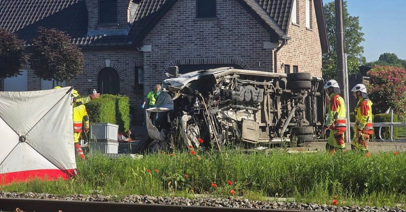 several hurt in crash between train and minibus carrying children in belgium