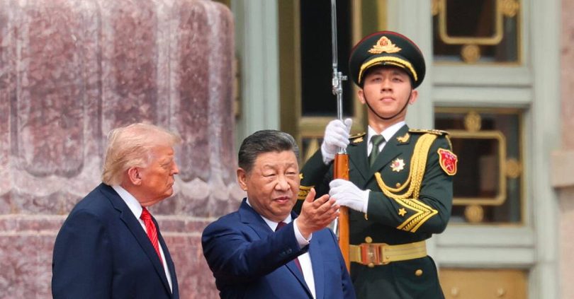 trump offers friendly words in beijing while xi issues cautionary warning