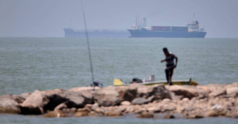 cargo ship hit while on un approved route through strait of hormuz