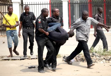 man arrested by nigerian police for looting during strike