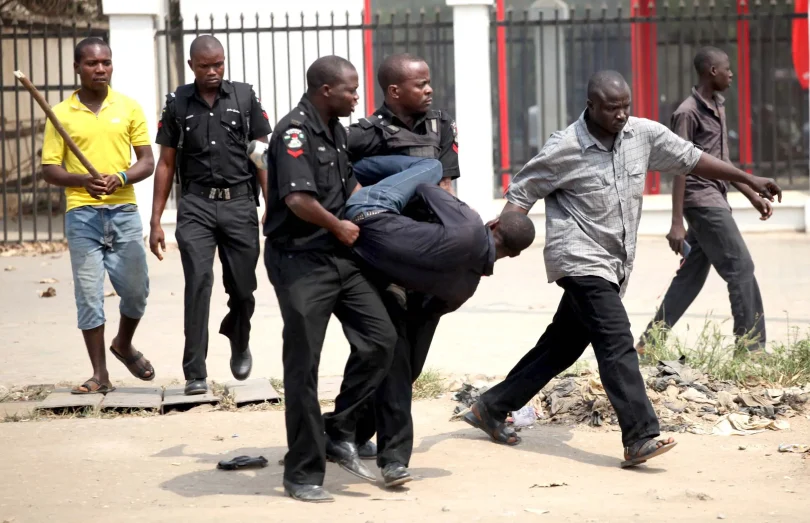 man arrested by nigerian police for looting during strike