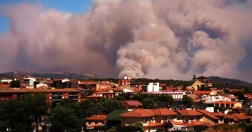 tens of thousands of people flee raging wildfires in france and spain